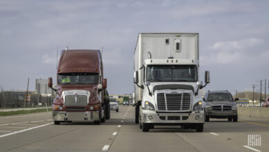 Trucks and cars on the road.