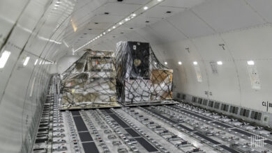 Interior of a Boeing 777 cargo jet with pallets.