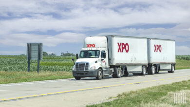 XPO tractor pulling XPO trailers on road