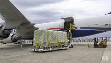 An oversize pallet on a sled is ready to be loaded on a freighter.