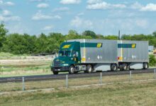 An ABF tractor pulling two LTL trailers on highway