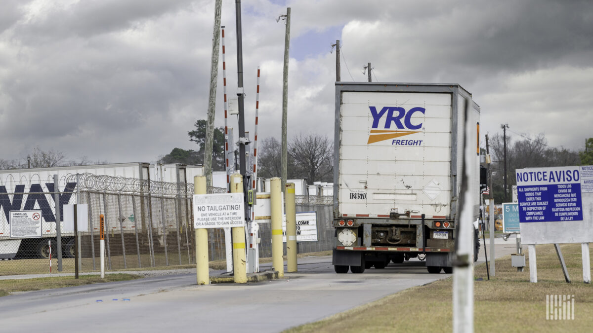 Rear view of YRC Freight rig entering Houston facility