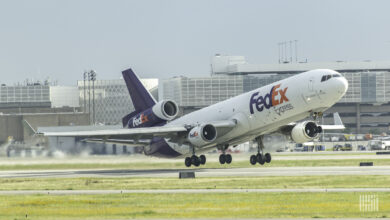 A purple-tailed FedEx plane takes off.