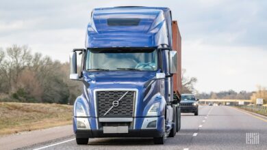 Blue Volvo VNR on highway