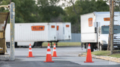 Yellow equipment parked at a closed facility