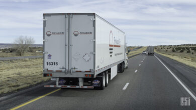 A rear view of a Forward Air trailer on the highway