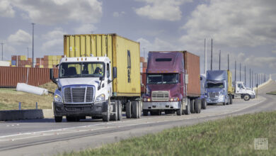 Tractors pulling containers out of a port