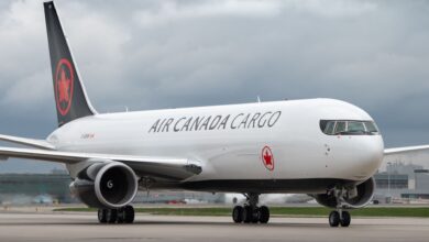 A black-tailed Air Canada Cargo jet on the ground.
