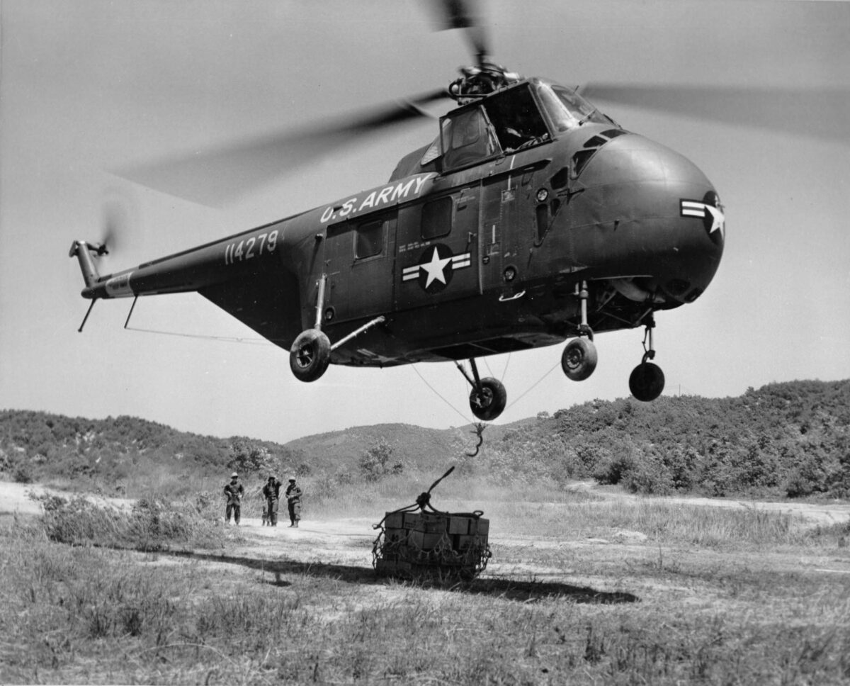 Helicopter dropping off supplies during Korean War