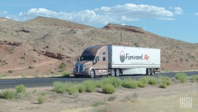 An unidentified tractor pulling a Forward Air trailer in the desert