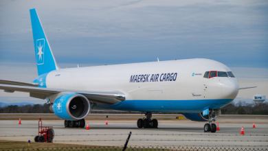 Diagonal close up of a light-blue tailed Maersk Air Cargo plane.