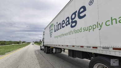 A Lineage Logistics trailer being pulled on a highway