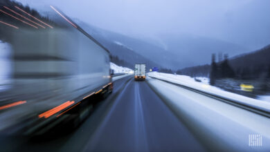trucks on road in snow