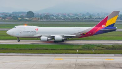 An Asiana Cargo jumbo jet rolls on the runway.