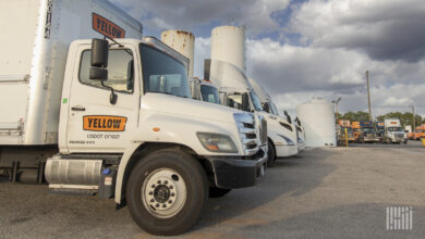 A photo of Yellow's trucks parked at a facility