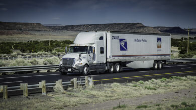 US Postal Service long-haul truck on the highway.