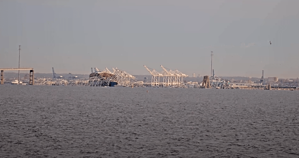 The collapsed section of the Francis Scott Key Bridge in Baltimore is seen more clearly after daybreak. (Photo: StreamTime Live/YouTube)