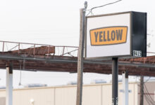 A Yellow sign at a terminal