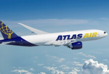 A blue-tailed Atlas Air jet high above the clouds.