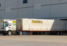 A J.B. Hunt yard truck with an intermodal container