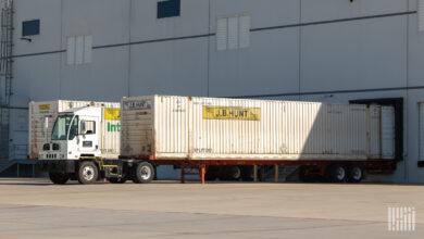 A J.B. Hunt yard truck with an intermodal container