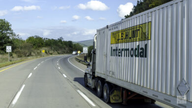 A tractor pulling a J.B. Hunt intermodal container on a highway