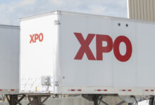 A white XPO trailer at a terminal