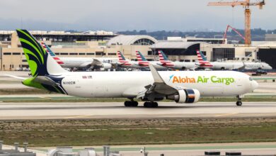 A green-tailed Aloha Air Cargo jet taxiing at LAX airport.