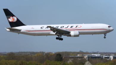 Blue-tailed Cargojet aircraft with maple-leaf logo comes in for a landing.