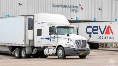 Truck trailers parked at an American Airlines cargo terminal.