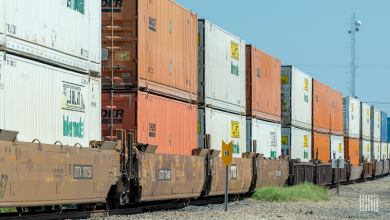 Images shows a container stack train, microwave tower and signs.