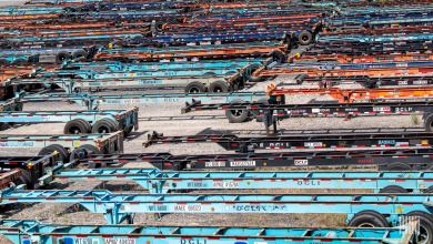 numerous chassis side by side at a rail yard