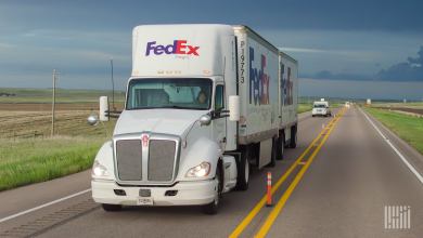 A FedEx Freight daycab pulling two pup trailers
