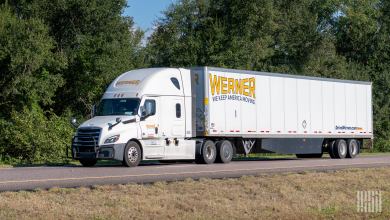 A white Werner sleeper cab pulling a white dryvan trailer on a highway
