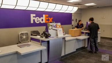 Someone being helped at the counter in a FedEx Office store.