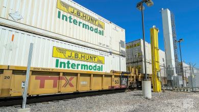 J.B. Hunt intermodal containers double stacked on a well car