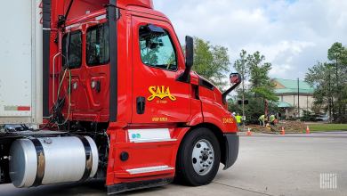 a closeup of a red Saia daycab