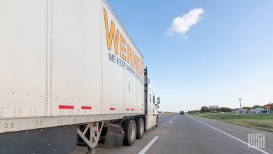 a sideview of a Werner trailer on a highway