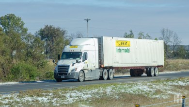 A white JB Hunt sleeper cab on a highway