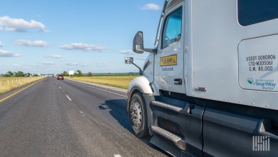 A white JB Hunt sleeper cab on a highway