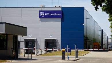 Image of a warehouse with UPS Healthcare logo.