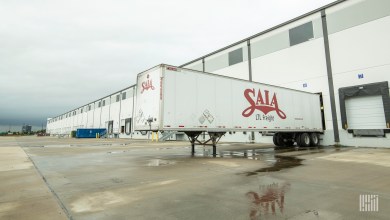 A Saia trailer loading at a terminal after a storm