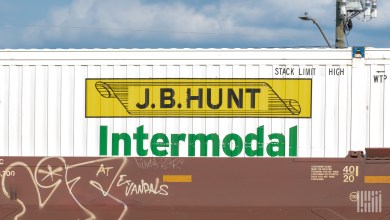 A JB Hunt intermodal container on a well car