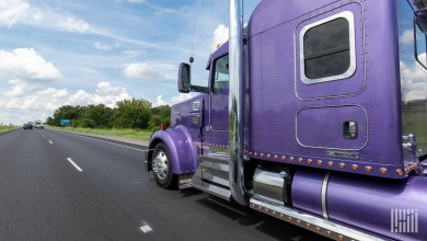 Truck with purple cab on highway
