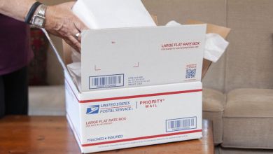 Close photo of a USPS Priority Mail package being filled.