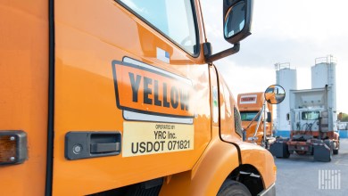 A Yellow tractor parked at a terminal