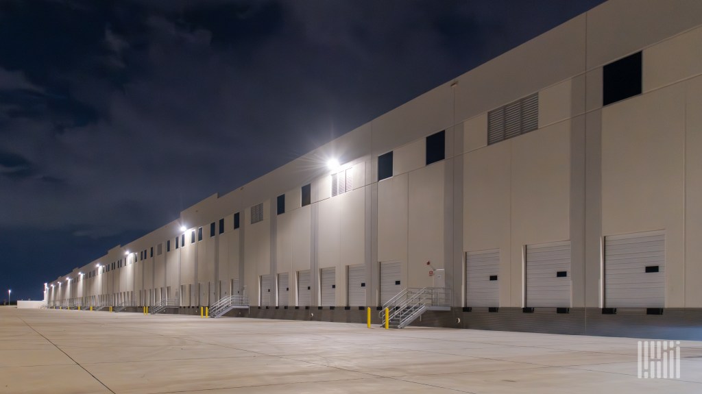 A nighttime view of empty loading docks at a warehouse