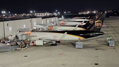 UPS brown tail aircraft at the main hub in Louisville at night.