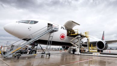 Air Canada Cargo plane is loaded with containers.