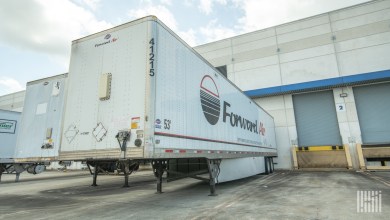 A white Forward Air trailer at an airport facility